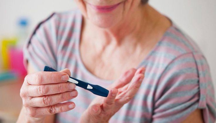 A patient taking an insulin shot