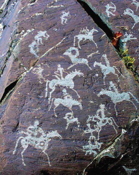 A picture of an ancient drawing on a mountain