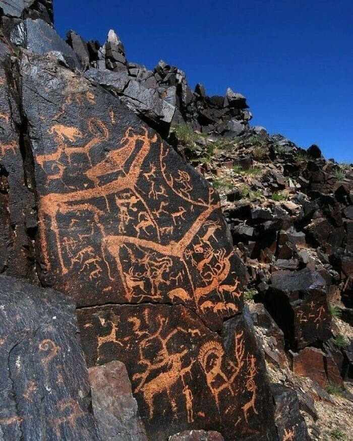 A picture of an ancient drawing on a mountain