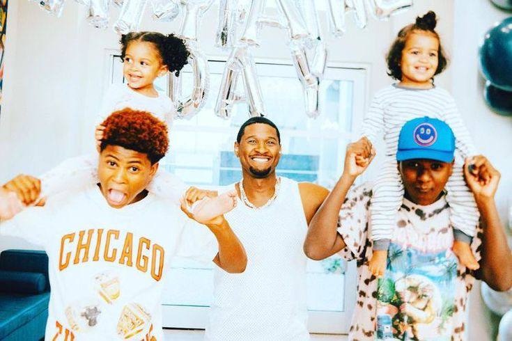 A picture of Usher and his kids