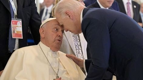 Biden and the Pope touching heads