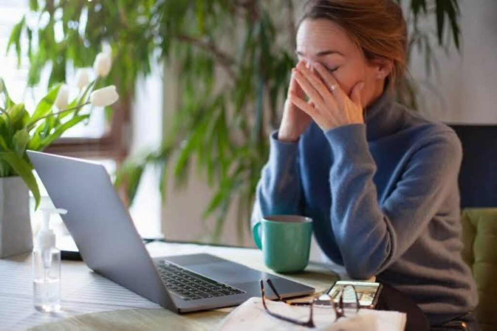 A Picture of a Woman Experiencing Brain Fatigue at Work