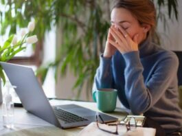 A Picture of a Woman Experiencing Brain Fatigue at Work