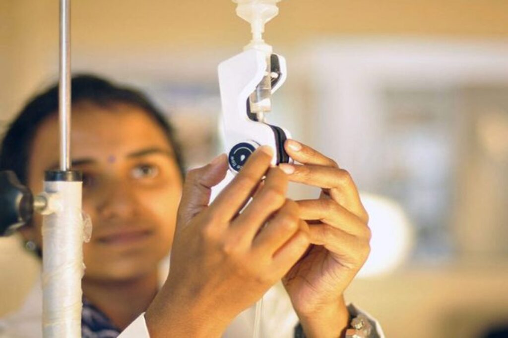 A Picture of person setting an IV.