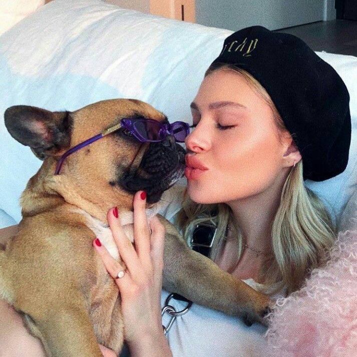 A picture of Nicola Peltz Beckham and Nala and a dog