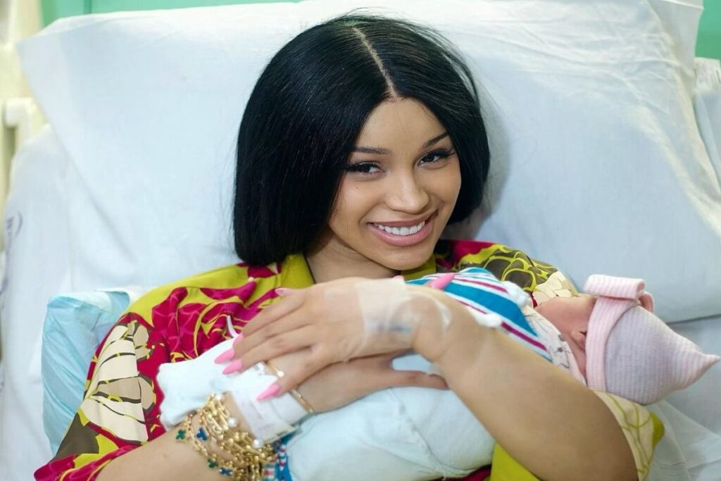 A picture of Cardi B holding her daughter