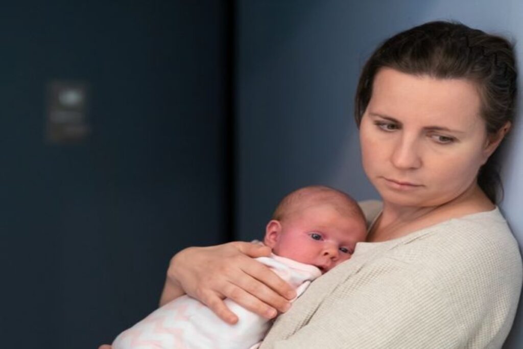 A picture of a woman holding a baby