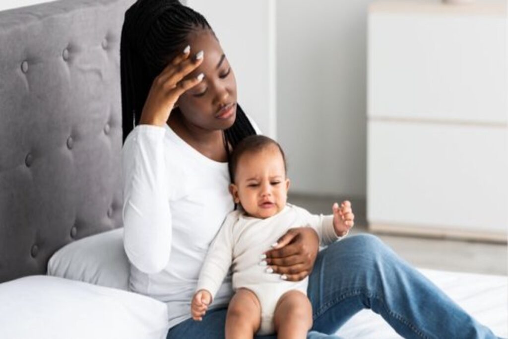 A picture of a woman holding a baby