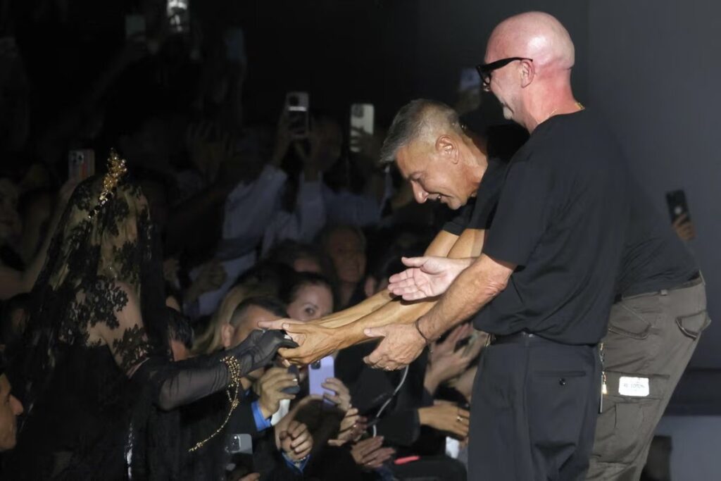 A picture of Stefano Gabbana and Domenico Dolce greeting Madonna