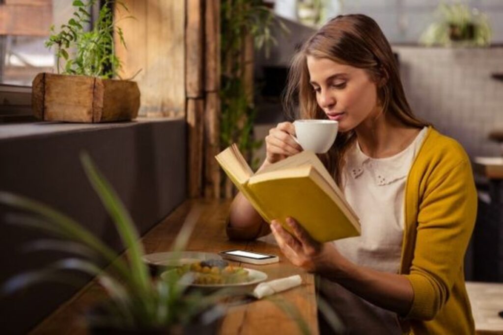 A picture of a woman drinking coffee.