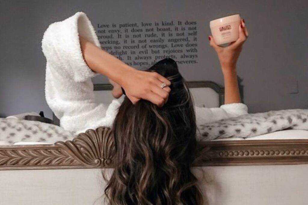 a picture of a woman holding an hair product