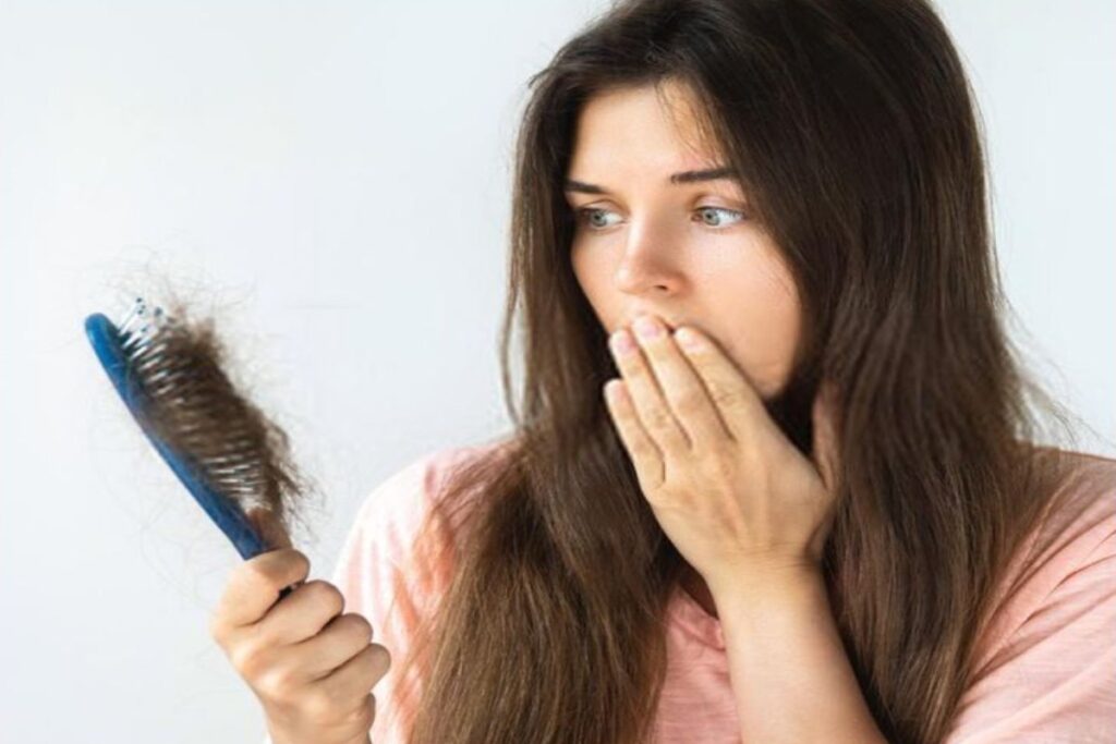 A picture of a woman reacting to hair loss