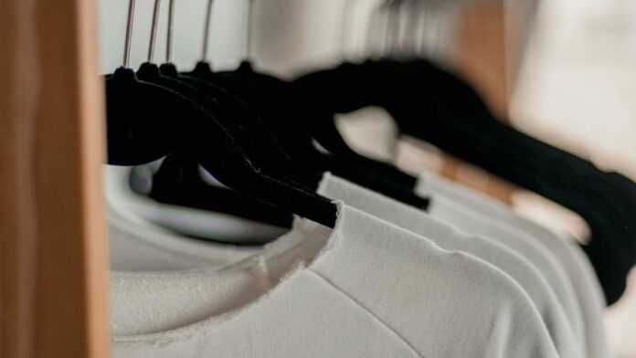 Hanged White Shirts on Black Clothes Hangers