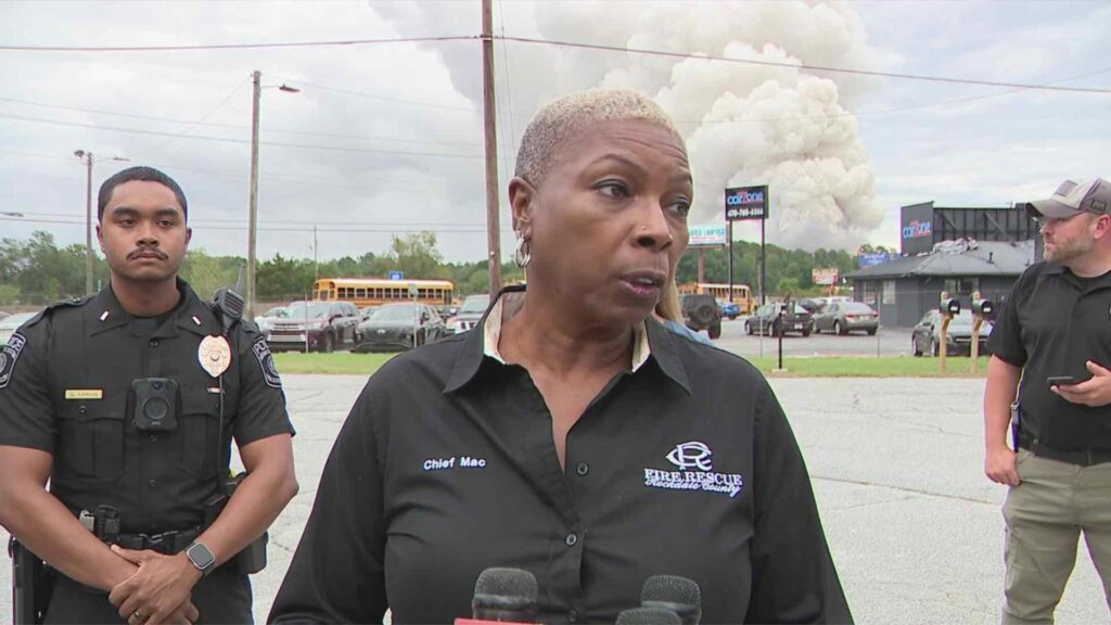 A picture of Authorities speaking about he chemical plant fire 