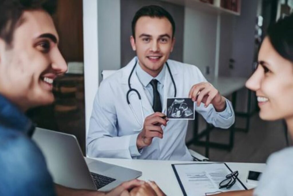 A picture of a doctor showing a couple a CT scan