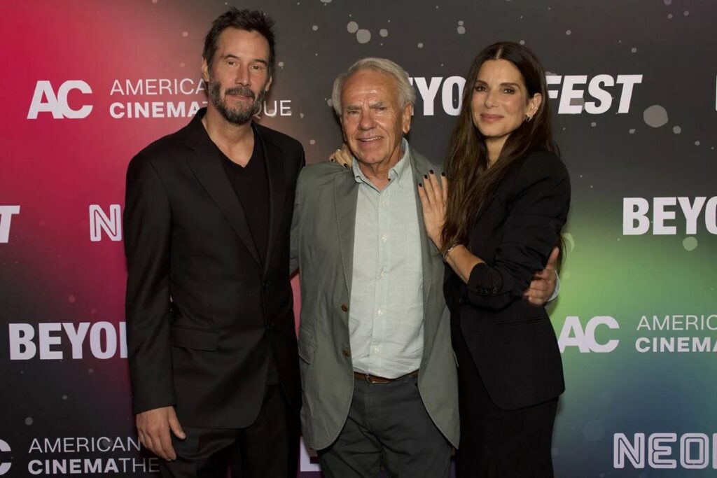 A picture of Jan de Bont, Sandra Bullock and keanu reeves