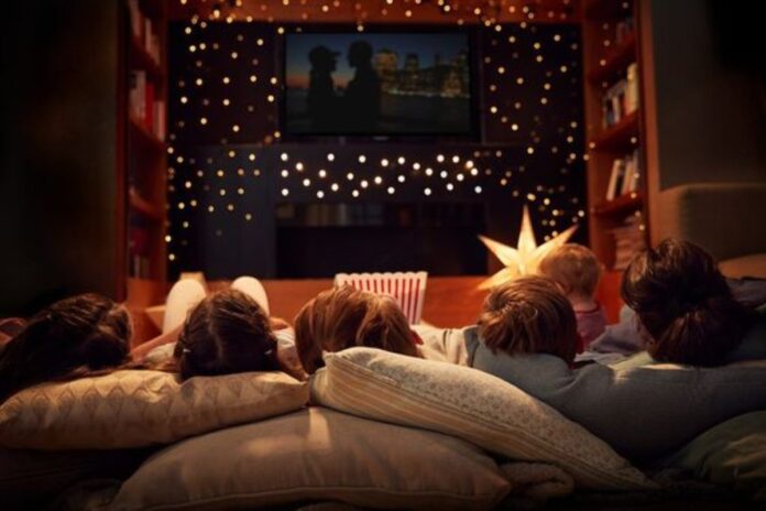 A picture of a family having a movie night