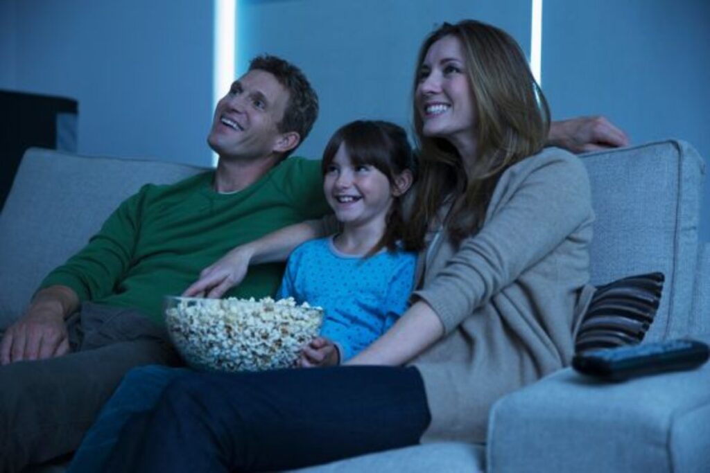 A picture of a family having a movie night