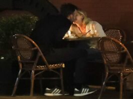 A picture of Jennifer Lawrence and husband kissing during lunch