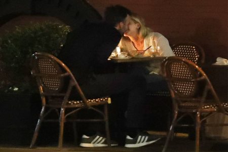 A picture of Jennifer Lawrence and husband kissing during lunch