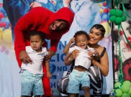 A picture of Nick Cannon, his twin sons, and their mother.