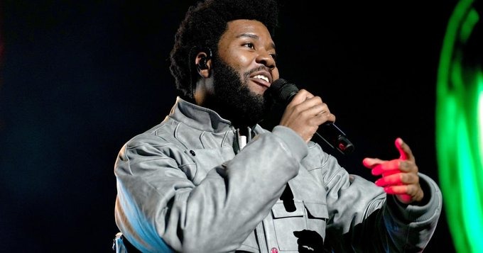 Khalid pictured on stage during a performance 