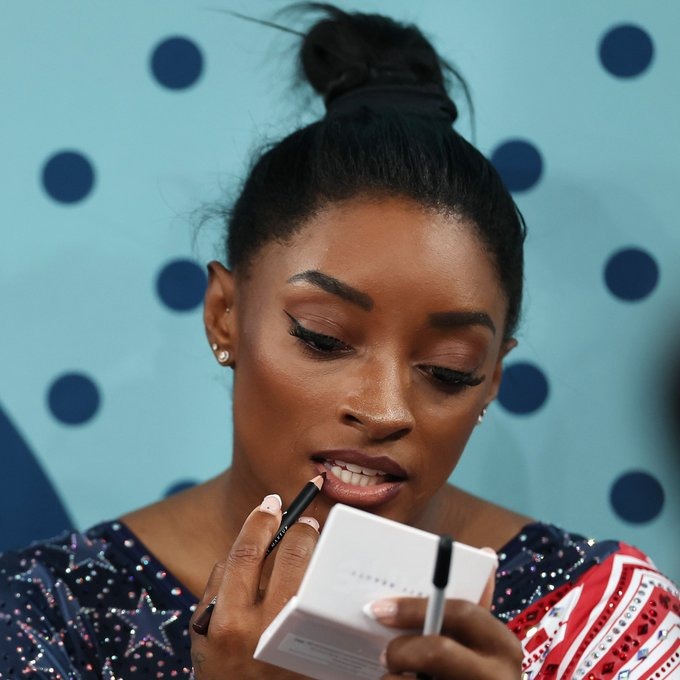 Simone Biles touching up on her makeup