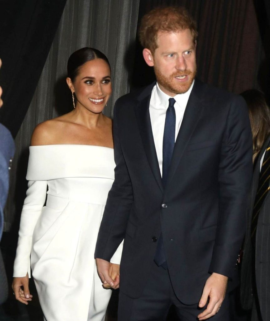 Harry on the move with Meghan in tow