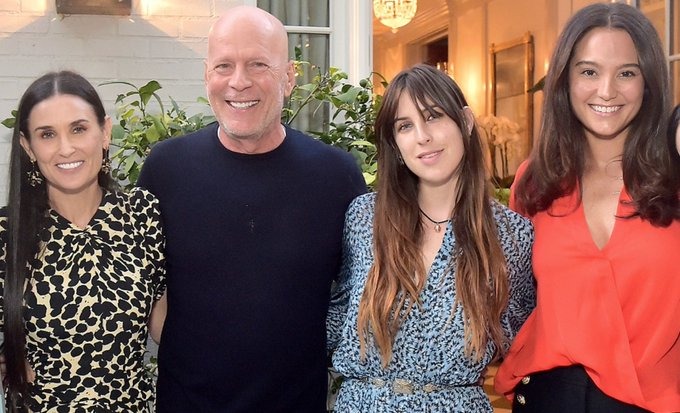 Bruce Willis posing with family