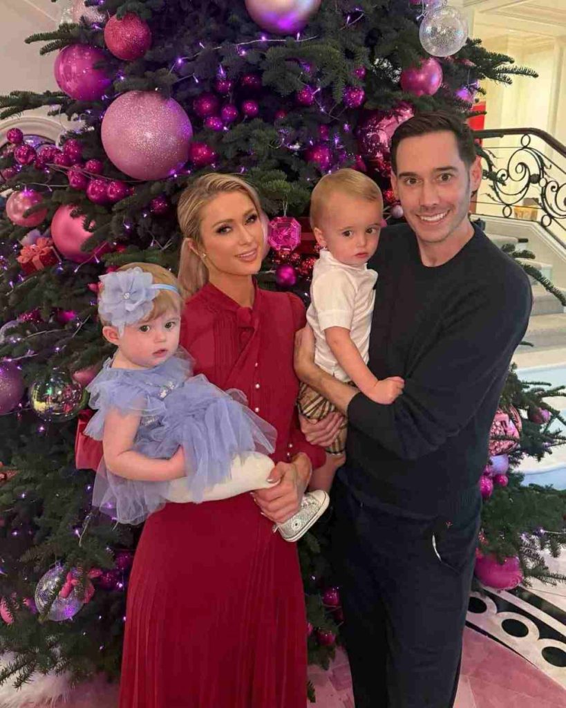 Paris Hilton's husband posing with her and their kids