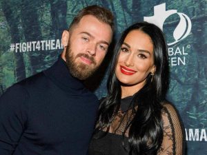 Artem Chigvintsev and Nikki Garcia posing together