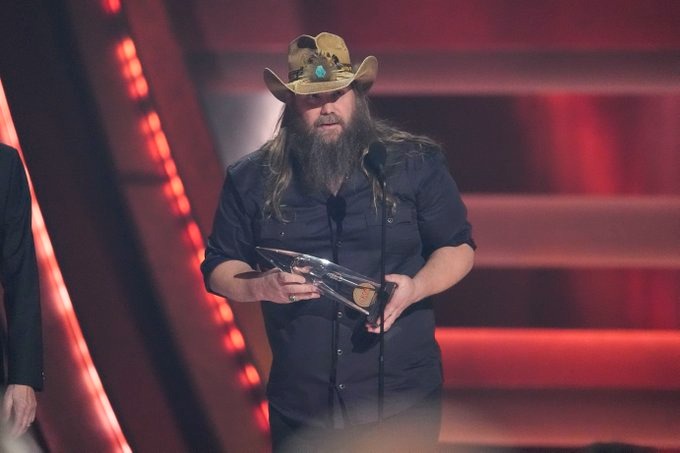 Chris Stapleton on stage receiving an award 