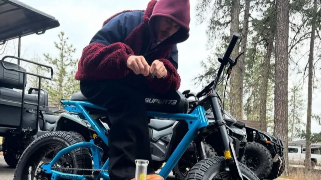 An image of Justin Bieber on a power bike and drunk