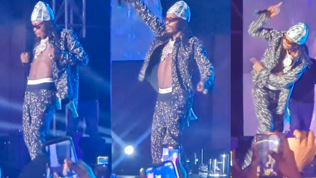Naira Marley on stage performing 