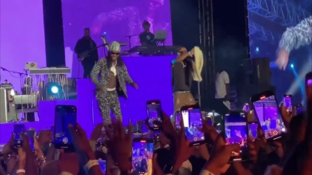 Naira Marley on stage performing